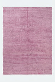 8' x 12' Rectangular Dusty Pink Mauve Solid Textured Modern Washable Area Rug displayed on a white background, showing its soft pink color and subtle texture.