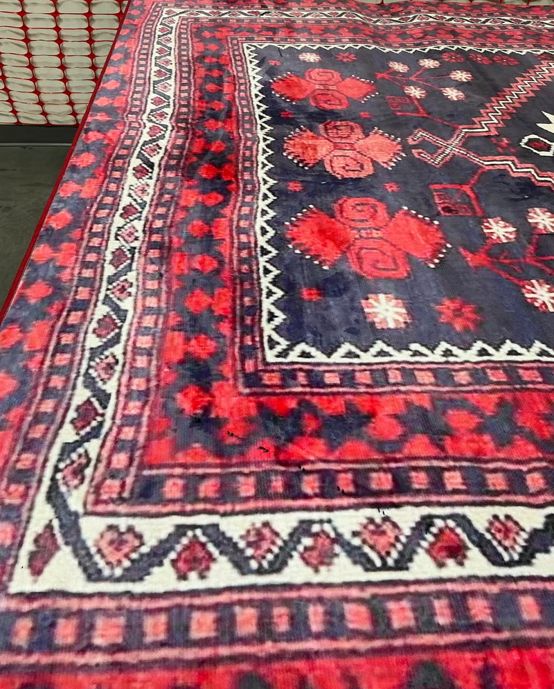 8' x 12' Rectangular Navy Blue Red Geometric Tribal Southwestern Area Rug shown in a close-up highlighting its bold red geometric motifs and patterned borders.