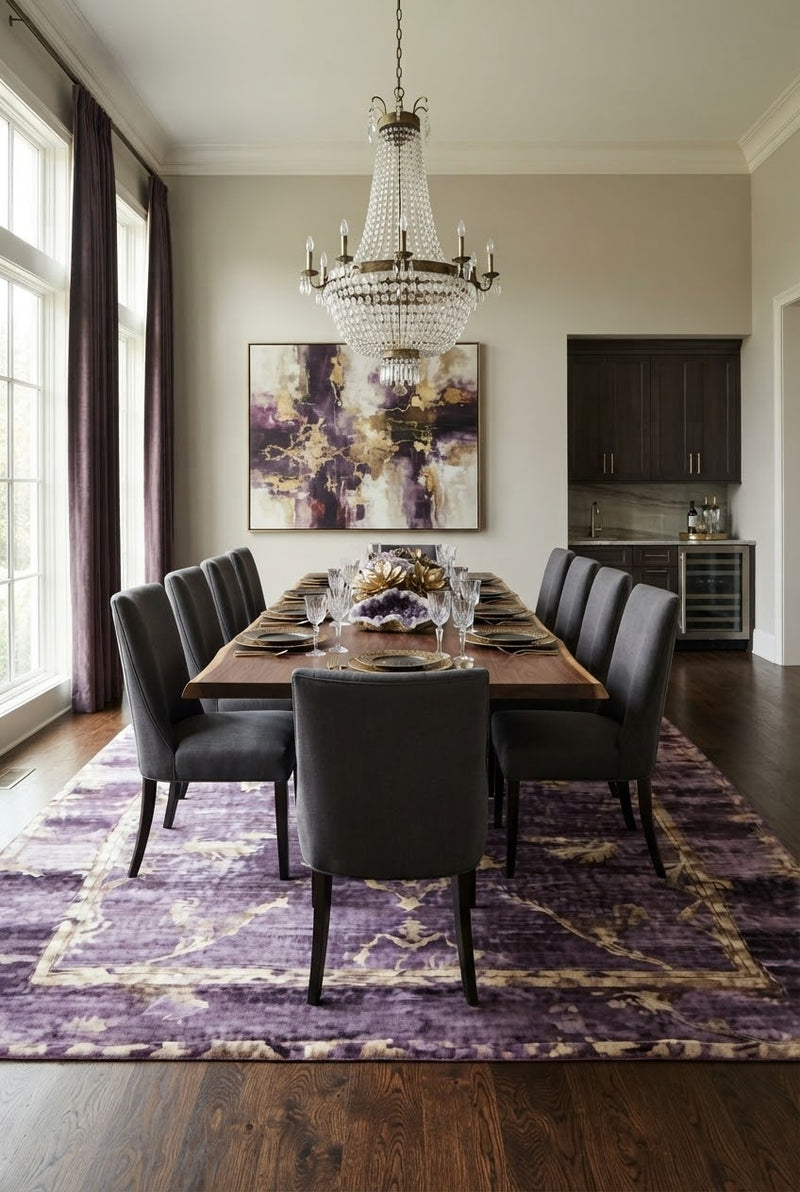 8' x 12' Rectangular Purple Beige Distressed Floral Medallion Vintage Traditional Area Rug styled in a formal dining room with a wooden table, gray upholstered chairs, and crystal chandelier.