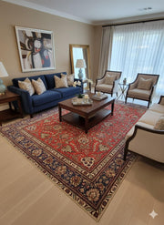 8' x 12' Rectangular Red Multi Color Floral Traditional Area Rug placed in a living room highlighting the vibrant red tones and classic floral motifs that complement traditional décor.