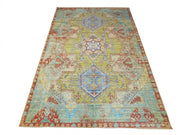 8' x 12' Rectangular Sage Green & Blue Distressed Geometric Medallion Southwestern Washable Area Rug displayed on a white background.