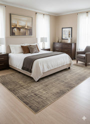 8' x 12' taupe and light beige grid washable area rug placed under a neutral upholstered bed in a warm minimalist bedroom setting.