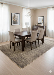 8' x 12' taupe modern grid washable area rug positioned beneath a dark wood dining table with upholstered chairs in a bright dining room.