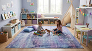 8' x 8' Square Blue & Purple Distressed Abstract Modern Area Rug styled in a colorful kids' playroom with two children playing, floor cushions, and toy shelves.