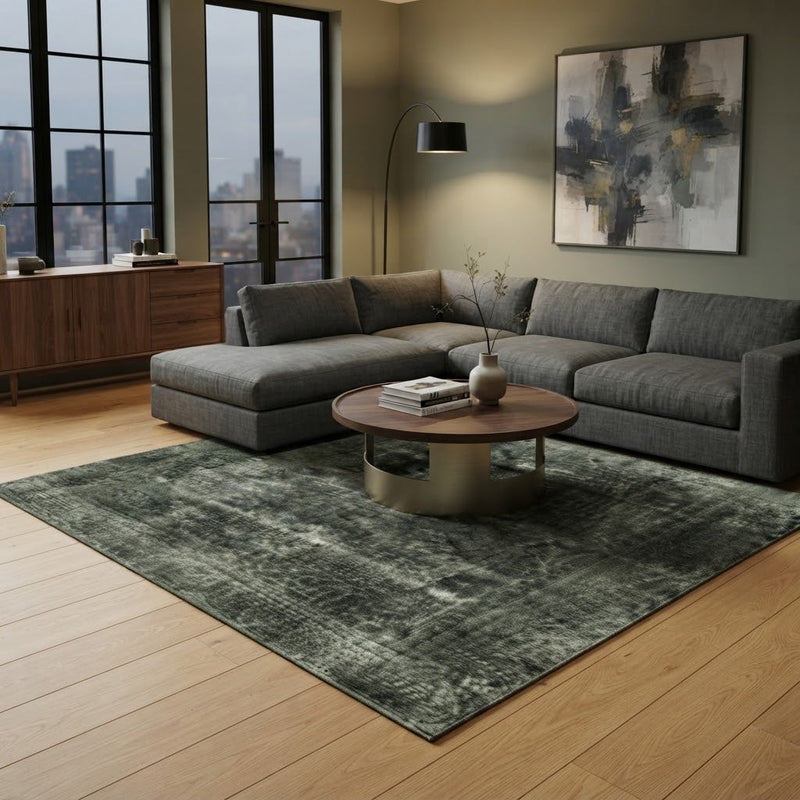 8' x 8' Square Dark Green & Gray Distressed Vintage Washable Area Rug styled in a modern living room with a gray sectional sofa and round wooden coffee table.