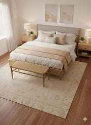 8' x 8' Square Ivory Pale Cream Beige Floral Vintage Washable Area Rug styled in a serene bedroom with a wooden bed, white bedding, soft peach pillows, and a woven bench.
