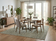 8' x 8' Square Ivory & Sage Green Repeating Geometric Modern Washable Area Rug styled in a dining room beneath a round wooden dining table and upholstered chairs.