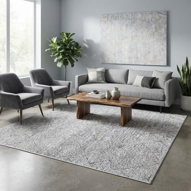 8' x 8' Square Light Gray & Ivory Abstract Geometric Modern Washable Area Rug styled in a living room with a gray sofa and wooden coffee table.