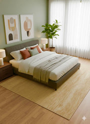 8' x 8' Square Natural Wheat & Warm Beige Solid Textured Washable Area Rug styled in bedroom under upholstered bed.