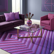 8' x 8' Square Purple & Pink Geometric Optical Modern Area Rug styled in a bold contemporary living room with violet accents.