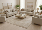 8' x 8' square beige and ivory textured minimalist area rug styled in a neutral living room with light wood furniture, cream sofas, and soft modern décor.