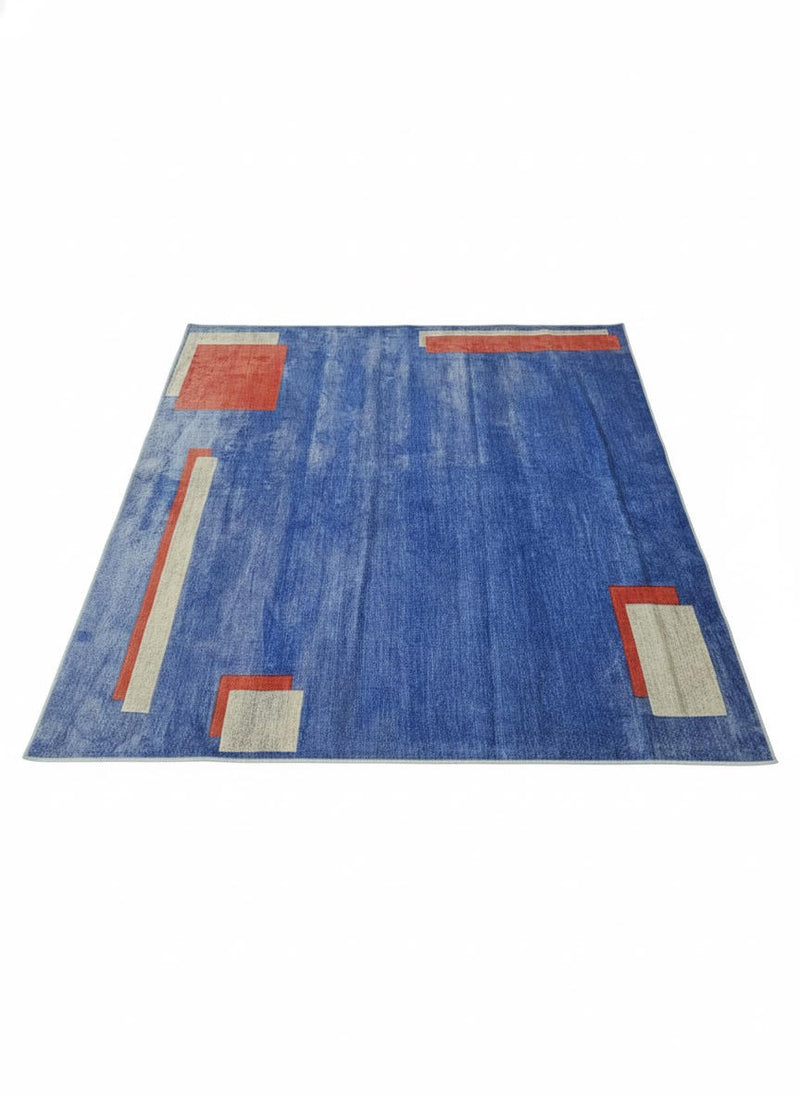 8' x 8' square blue area rug featuring a contemporary geometric design with rust and beige accent blocks and a subtle textured background.