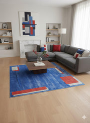 8' x 8' square blue, rust, and beige geometric rug styled in a modern living room with a gray sectional sofa, wood coffee table, and minimalist décor.