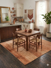 8' x 8' square terracotta & beige textured abstract modern area rug styled in a modern dining area with a wooden table and natural textures.