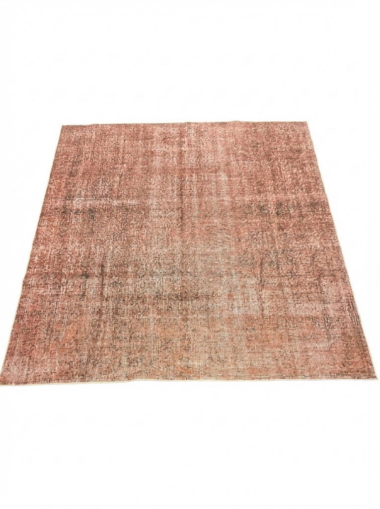 8' x 8' square washable area rug featuring a rose pink distressed vintage texture with beige and subtle brown tonal accents and non-slip backing.