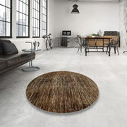 8ft Round Brown Beige Distressed Abstract Modern Rug displayed in a contemporary loft living space, highlighting the subtle distressed texture and modern round shape.