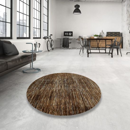 8ft Round Brown Beige Distressed Abstract Modern Rug displayed in a contemporary loft living space, highlighting the subtle distressed texture and modern round shape.