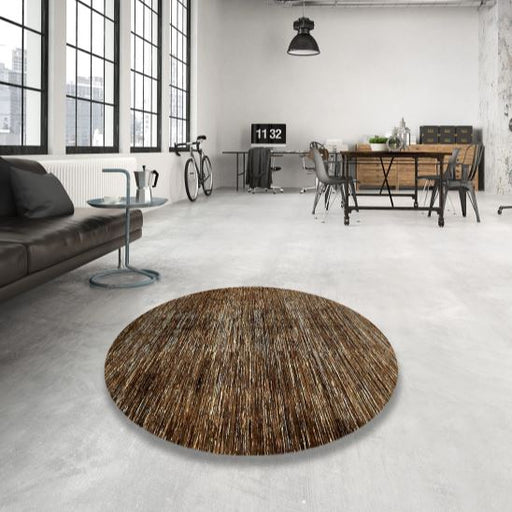 8ft Round Brown Beige Distressed Abstract Modern Rug displayed in a contemporary loft living space, highlighting the subtle distressed texture and modern round shape.