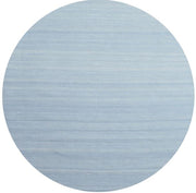 Round rug featuring a solid denim blue surface with subtle horizontal texture for a clean modern look.
